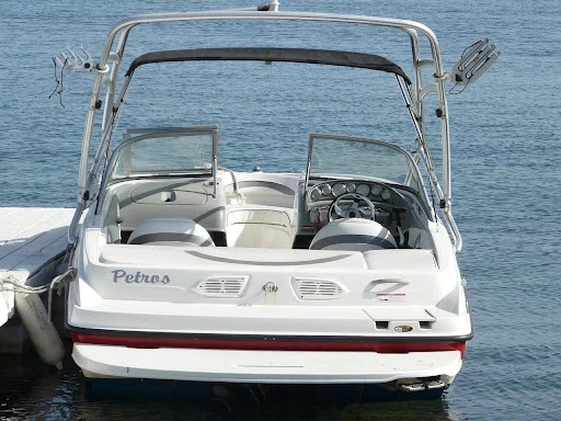 Mechanic inspecting marine electronics on a used boat