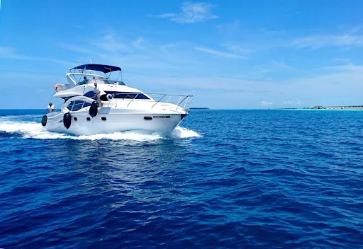 Calculator and paperwork showing the cost breakdown of a boat warranty
